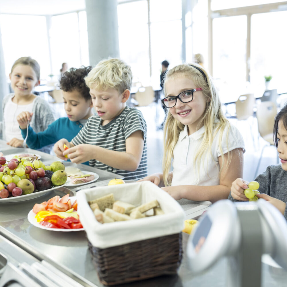Pupils at counter in school canteen